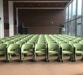 Armchair with wheels and folding tablet for conference room, seminar, congress room