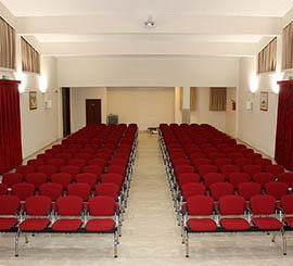 Benches fixed on the ground for parish and church multipurpose room